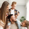 a family playing together on a couch