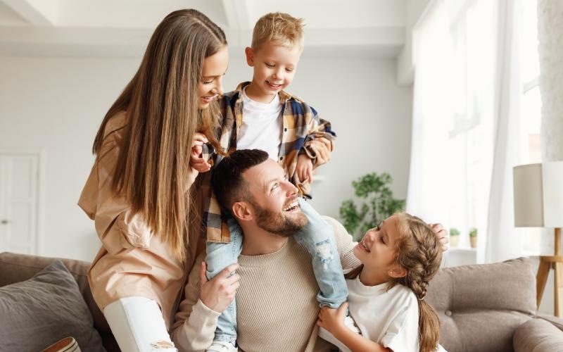 a family sitting on a couch